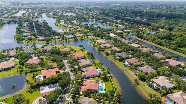 bird's eye view with a residential view and a water view