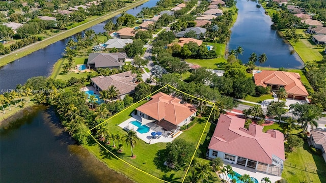 aerial view featuring a water view and a residential view