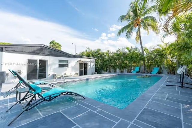 view of swimming pool with a patio and a fenced in pool