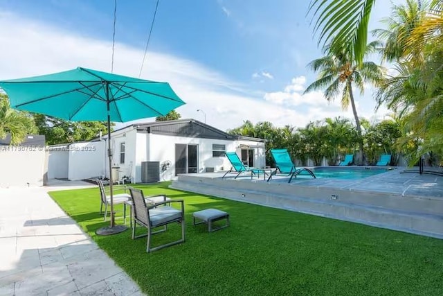 exterior space featuring fence, cooling unit, and a fenced in pool