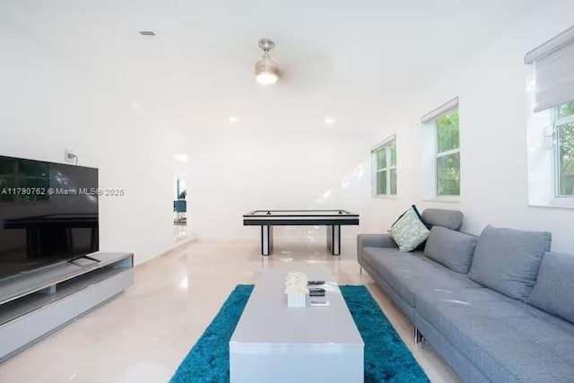 living room featuring concrete flooring