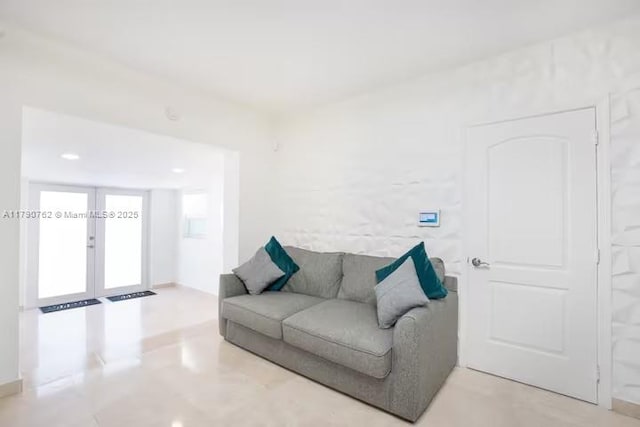 living area with recessed lighting and french doors