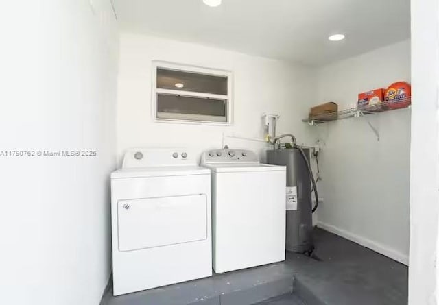 laundry area featuring recessed lighting, separate washer and dryer, laundry area, and electric water heater
