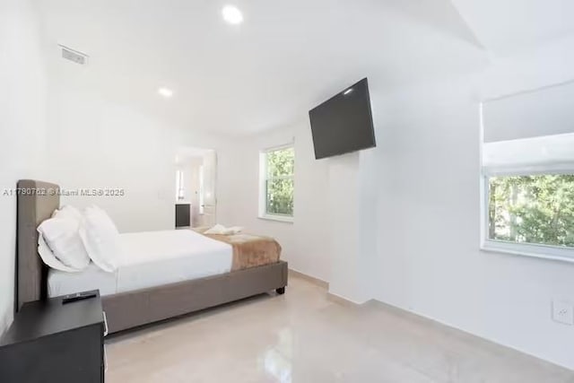 bedroom featuring visible vents, recessed lighting, and multiple windows