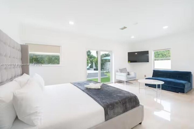 bedroom featuring recessed lighting, access to outside, and multiple windows