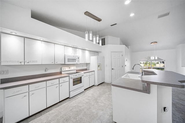 kitchen with visible vents, white appliances, white cabinets, and a sink