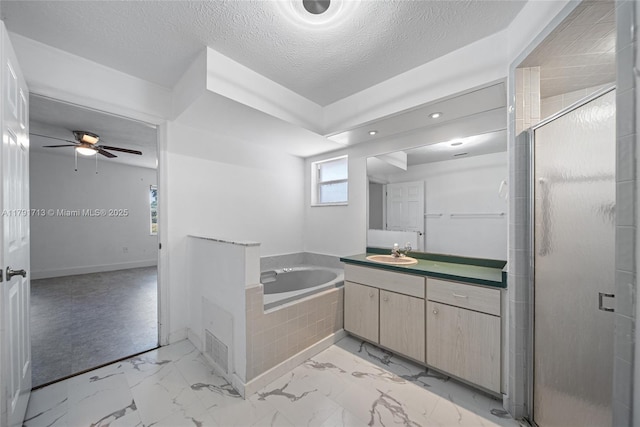 bathroom featuring a shower stall, a bath, vanity, a ceiling fan, and marble finish floor