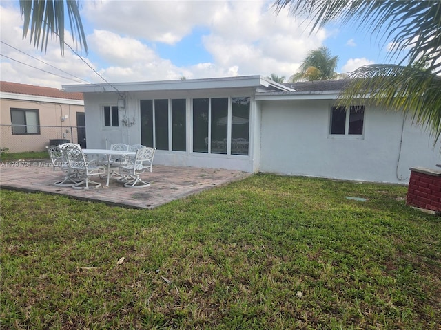 1540 NE 173rd St, North Miami Beach, FL 33162 - back of property with a patio area and stucco siding