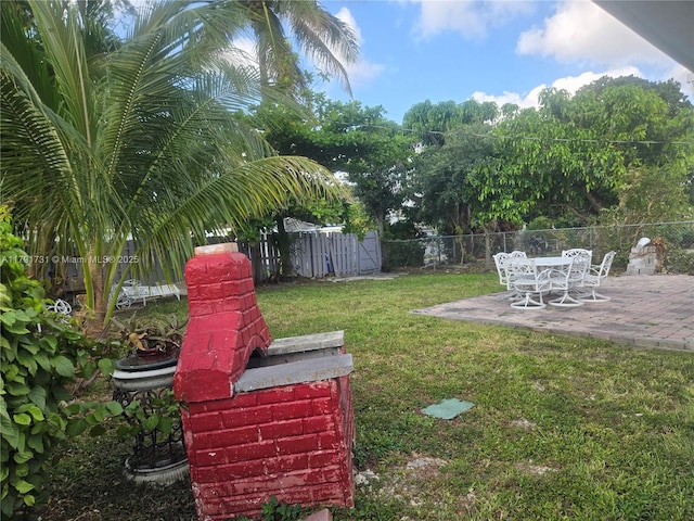 1540 NE 173rd St, North Miami Beach, FL 33162 - view of yard with a patio area