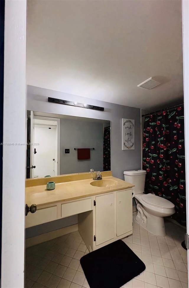 full bathroom with toilet, vanity, curtained shower, and tile patterned floors