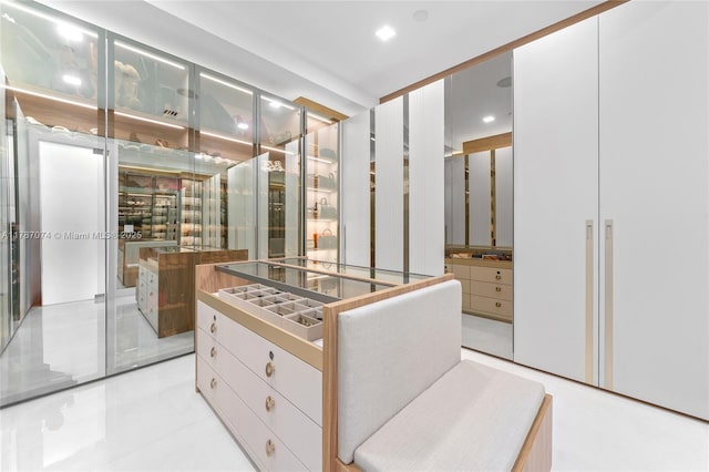 walk in closet featuring light tile patterned flooring