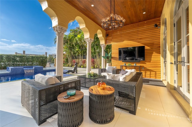 view of patio / terrace with outdoor lounge area and a fenced in pool