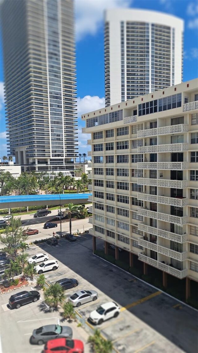 1801 S Ocean Dr Unit 842, Hallandale Beach, FL 33009 - view of building exterior with uncovered parking and a city view