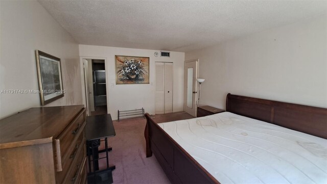 1801 S Ocean Dr Unit 842, Hallandale Beach, FL 33009 - carpeted bedroom with a textured ceiling, visible vents, and a closet