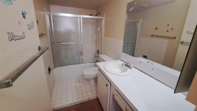 1801 S Ocean Dr Unit 842, Hallandale Beach, FL 33009 - bathroom featuring vanity, tile patterned floors, bath / shower combo with glass door, and toilet