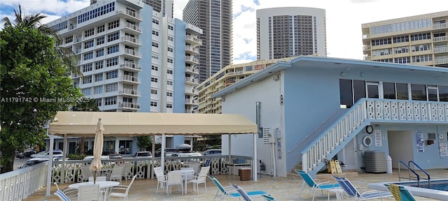 1801 S Ocean Dr Unit 842, Hallandale Beach, FL 33009 - view of building exterior with stairs and cooling unit