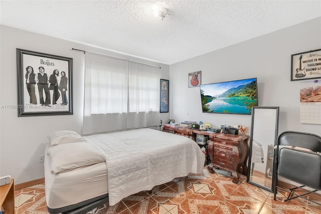 bedroom featuring a textured ceiling