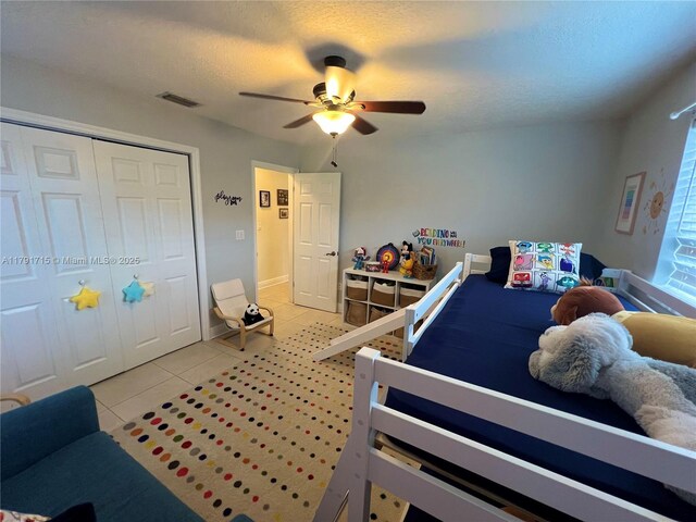 14051 SW 15th Ct, Davie, FL 33325 - bedroom with light tile patterned floors, a closet, and ceiling fan