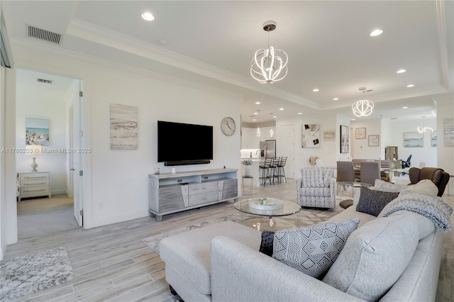 26047 SW Viterbo Way, Port St Lucie, FL 34986 - living area featuring recessed lighting, visible vents, a chandelier, and a raised ceiling