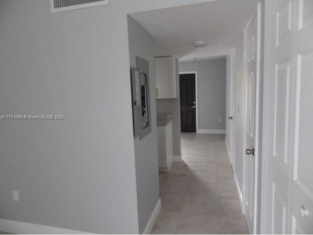 1990 NW 4th Ct Unit 8, Miami, FL 33136 - corridor with light tile patterned floors, visible vents, electric panel, and baseboards