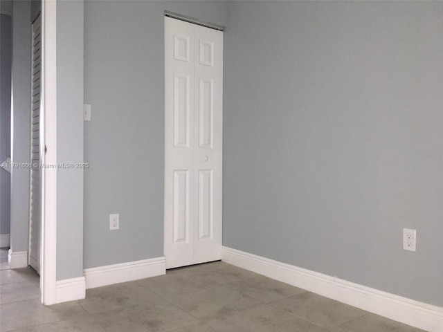 1990 NW 4th Ct Unit 8, Miami, FL 33136 - unfurnished bedroom with baseboards and tile patterned flooring
