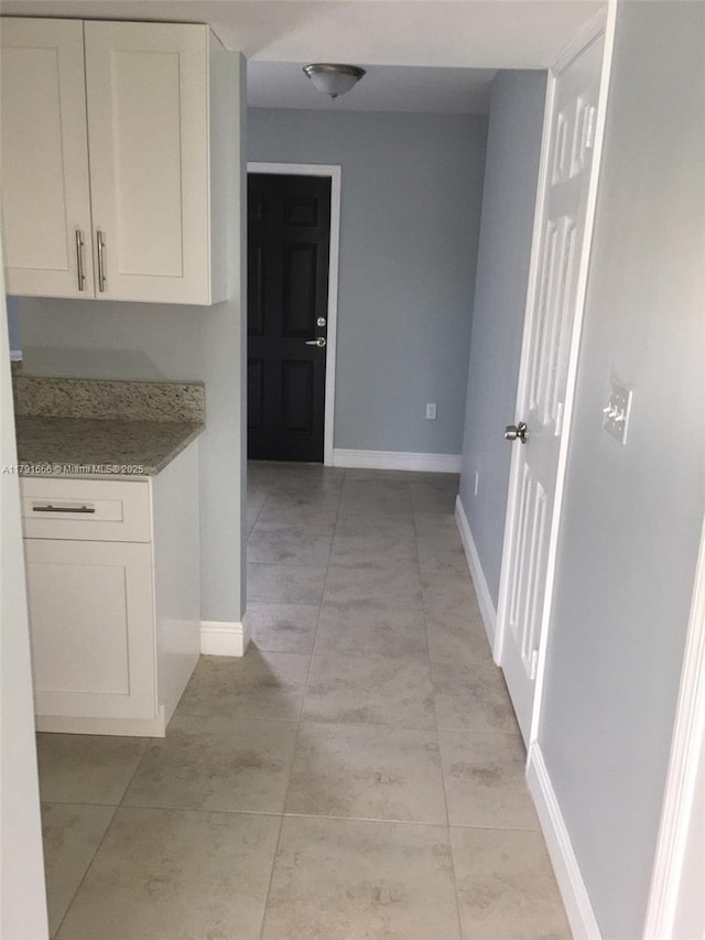 1990 NW 4th Ct Unit 8, Miami, FL 33136 - hall with baseboards and light tile patterned floors