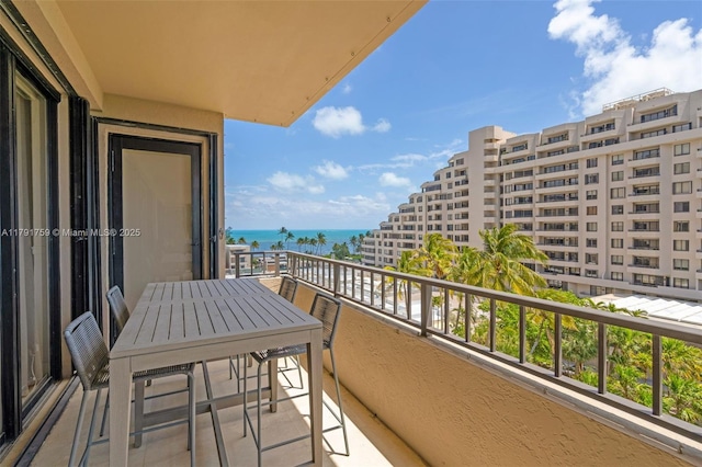 balcony featuring a water view