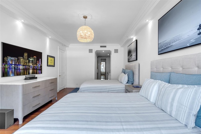 bedroom featuring crown molding, visible vents, an inviting chandelier, recessed lighting, and wood finished floors