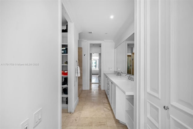 bathroom with tile patterned floors, visible vents, and vanity