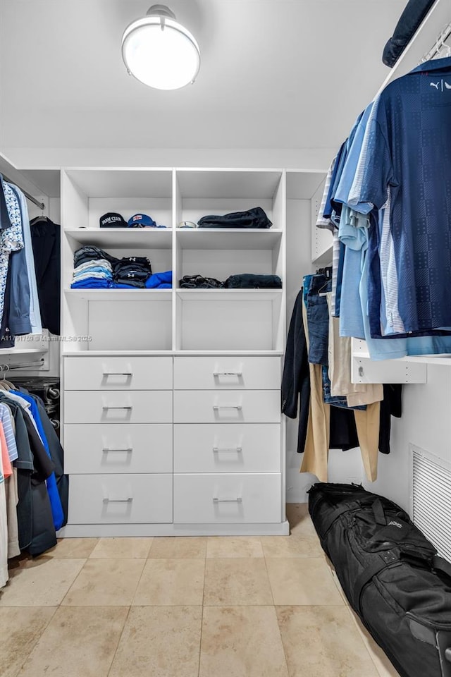 spacious closet featuring visible vents