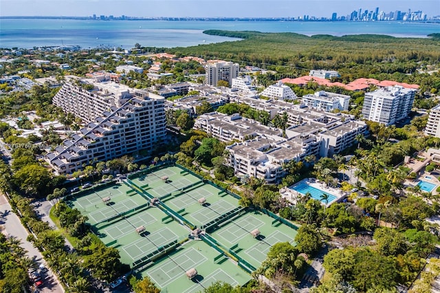 bird's eye view with a wooded view, a city view, and a water view