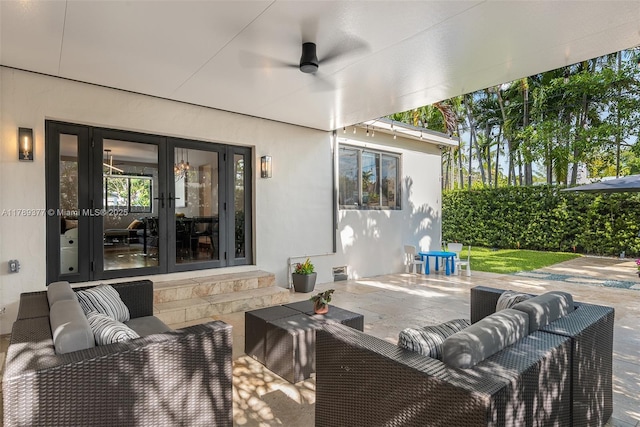 view of patio with outdoor lounge area, a ceiling fan, and french doors