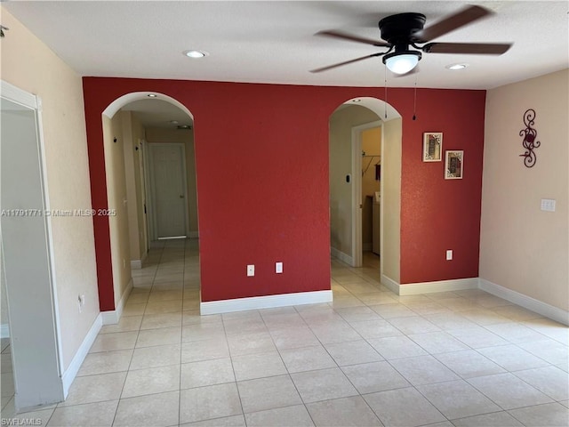 1127 Foggia St E, Lehigh Acres, FL 33974 - unfurnished room featuring light tile patterned floors, a ceiling fan, recessed lighting, and arched walkways