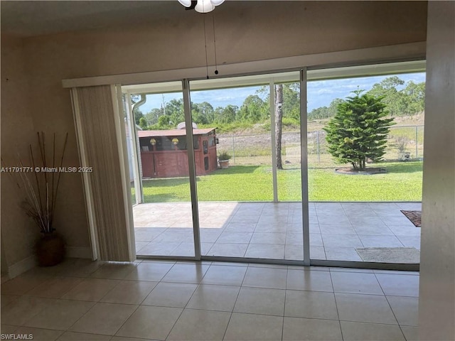 1127 Foggia St E, Lehigh Acres, FL 33974 - entryway with tile patterned floors and baseboards