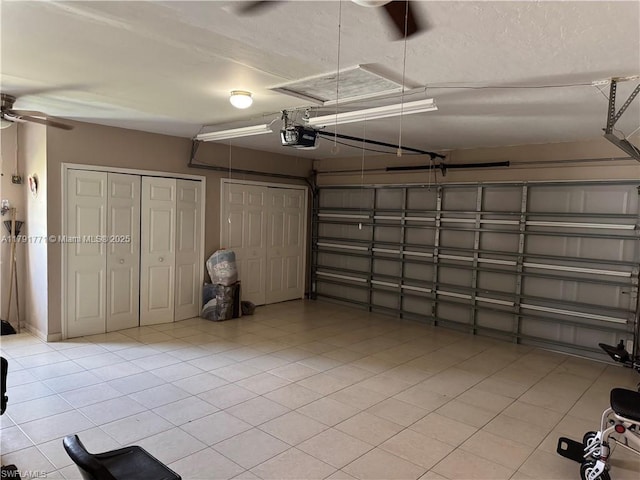 1127 Foggia St E, Lehigh Acres, FL 33974 - garage with a garage door opener and ceiling fan