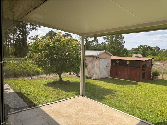1127 Foggia St E, Lehigh Acres, FL 33974 - view of yard with an outbuilding, a patio, fence, and a shed