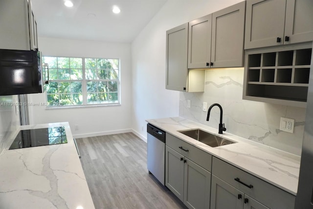 kitchen with black electric cooktop, gray cabinetry, dishwasher, and a sink