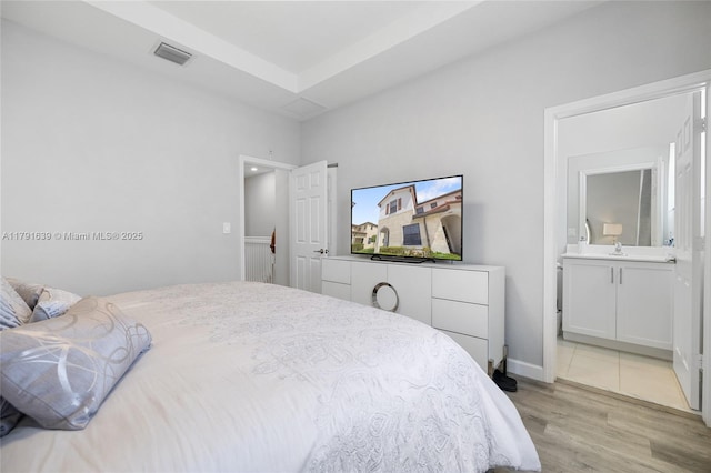 3289 W 106th Ter, Hialeah, FL 33018 - bedroom featuring visible vents, ensuite bathroom, and light wood finished floors