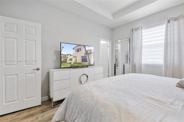 3289 W 106th Ter, Hialeah, FL 33018 - bedroom featuring baseboards and light wood-style floors