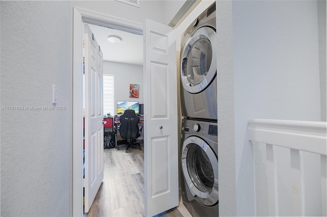 3289 W 106th Ter, Hialeah, FL 33018 - clothes washing area featuring stacked washer and dryer and light wood-style flooring