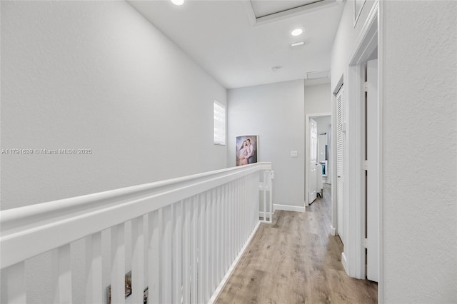 3289 W 106th Ter, Hialeah, FL 33018 - corridor with baseboards, recessed lighting, attic access, and light wood finished floors