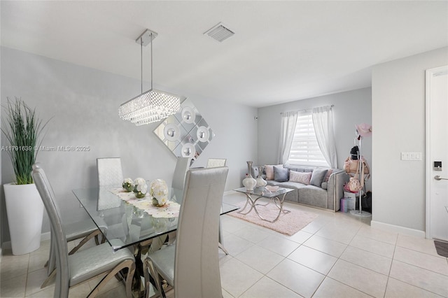 3289 W 106th Ter, Hialeah, FL 33018 - dining space featuring baseboards, visible vents, and light tile patterned floors
