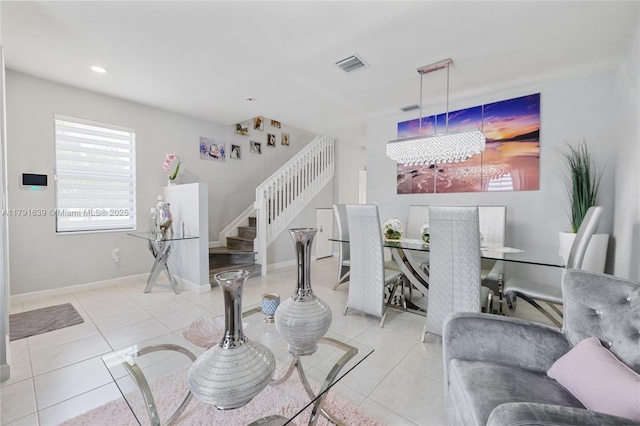 3289 W 106th Ter, Hialeah, FL 33018 - living room featuring visible vents, a notable chandelier, stairs, and tile patterned flooring