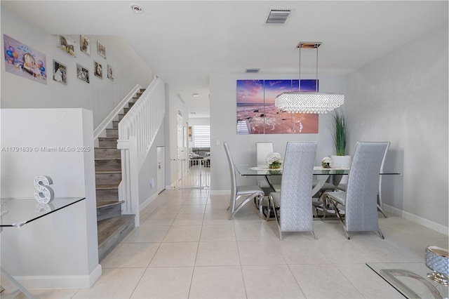 3289 W 106th Ter, Hialeah, FL 33018 - dining space with tile patterned flooring, visible vents, stairway, and baseboards