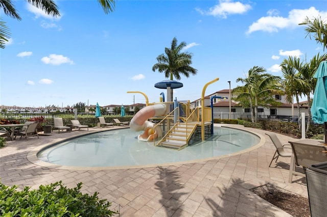3289 W 106th Ter, Hialeah, FL 33018 - community playground with fence, a water play area, a patio, and a community pool