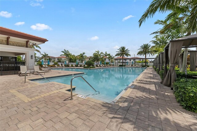 3289 W 106th Ter, Hialeah, FL 33018 - community pool featuring a patio area