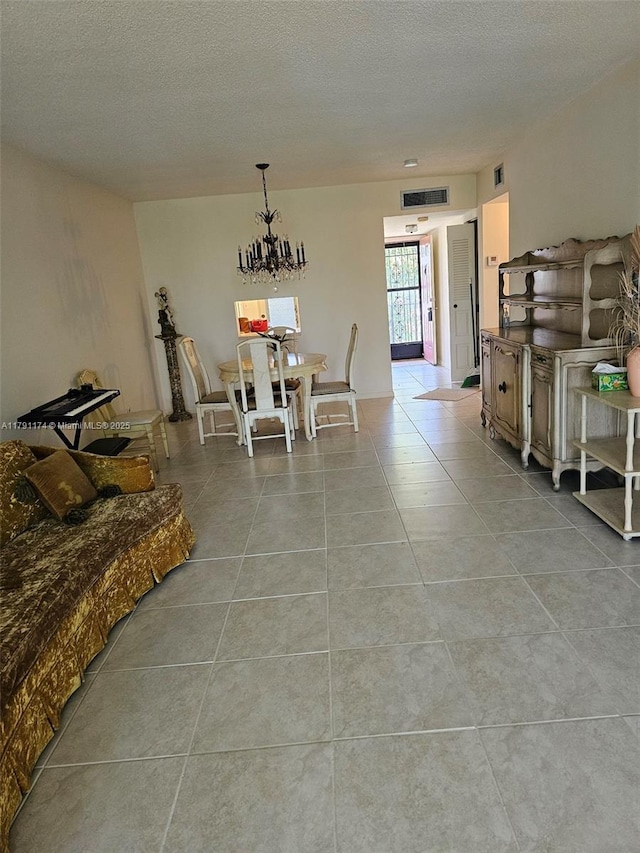 1103 NW 58th Ter Unit 321, Sunrise, FL 33313 - dining room with light tile patterned floors and a textured ceiling