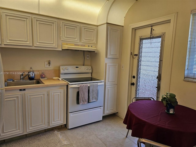 1103 NW 58th Ter Unit 321, Sunrise, FL 33313 - kitchen featuring white electric range, under cabinet range hood, light countertops, and light tile patterned floors