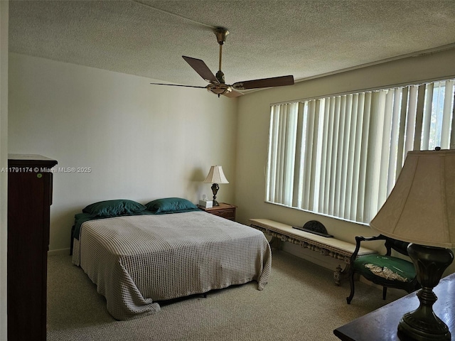1103 NW 58th Ter Unit 321, Sunrise, FL 33313 - bedroom featuring multiple windows, carpet, ceiling fan, and a textured ceiling