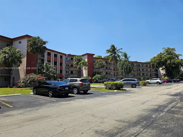 1103 NW 58th Ter Unit 321, Sunrise, FL 33313 - view of apartment building / complex featuring uncovered parking